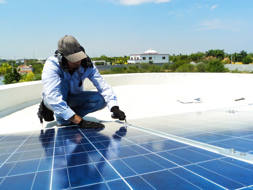 Engineer install a solar panel on roof Top